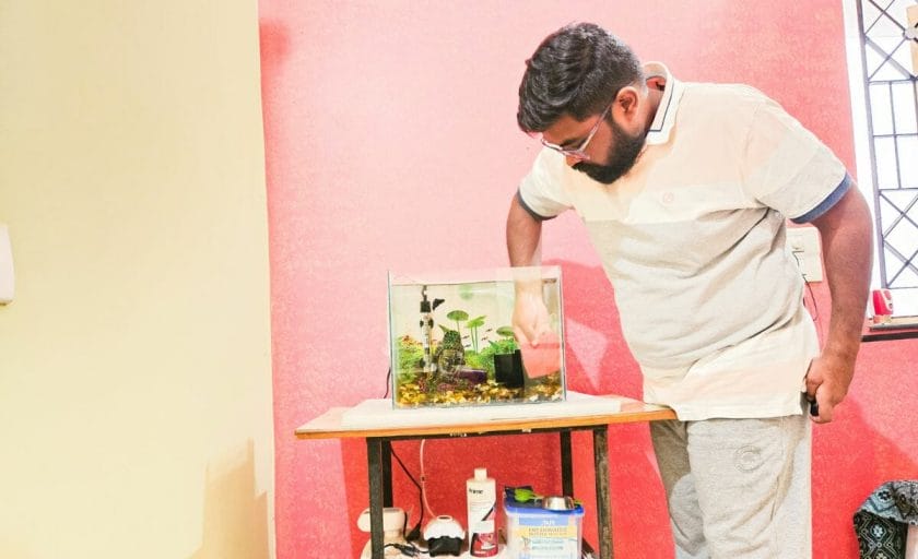 Prathmesh Gawai cleaning his Betta fish tank